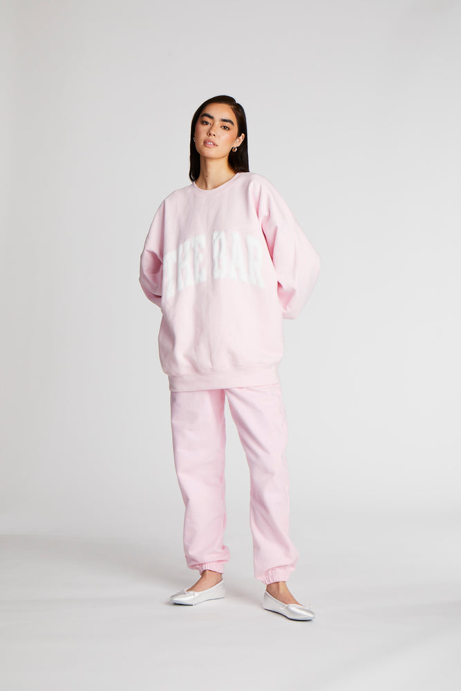 
                  
                    Load image into Gallery viewer, VARSITY SWEATPANTS BLUSH/WHITE
                  
                