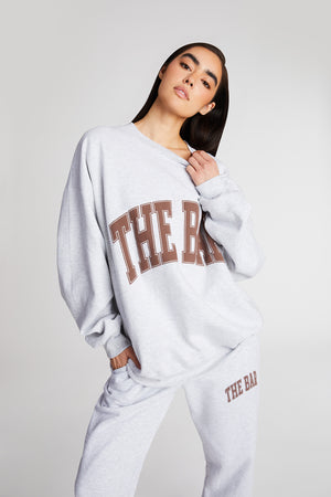 
                  
                    Load image into Gallery viewer, VARSITY SWEATPANTS LT HEATHER GREY/CHOCOLATE
                  
                