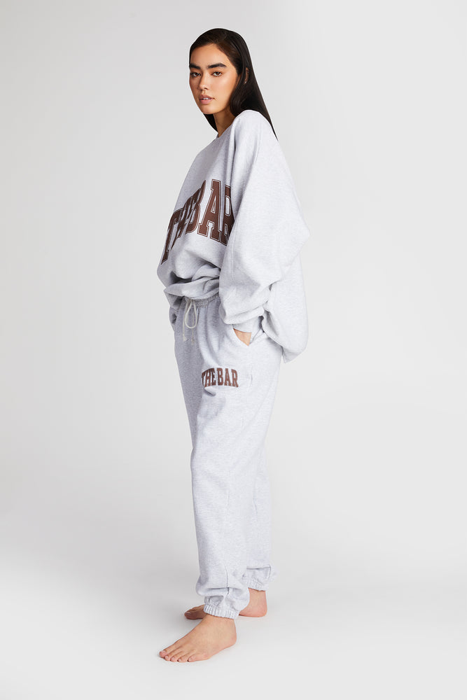 
                  
                    Load image into Gallery viewer, VARSITY SWEATPANTS LT HEATHER GREY/CHOCOLATE
                  
                