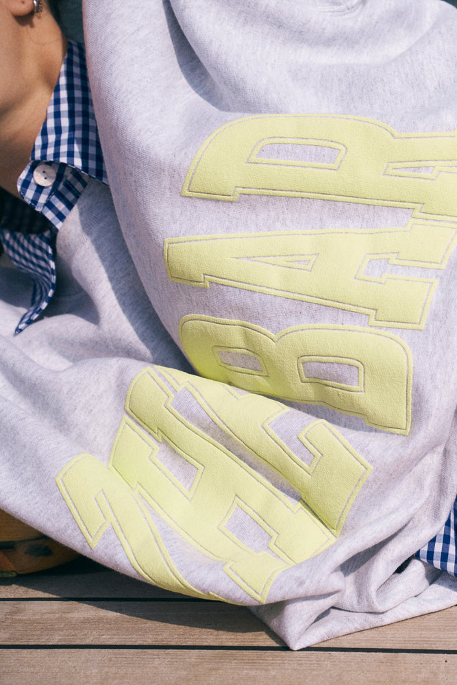 
                  
                    Load image into Gallery viewer, VARSITY SWEATSHIRT LT HEATHER GREY/LEMON
                  
                